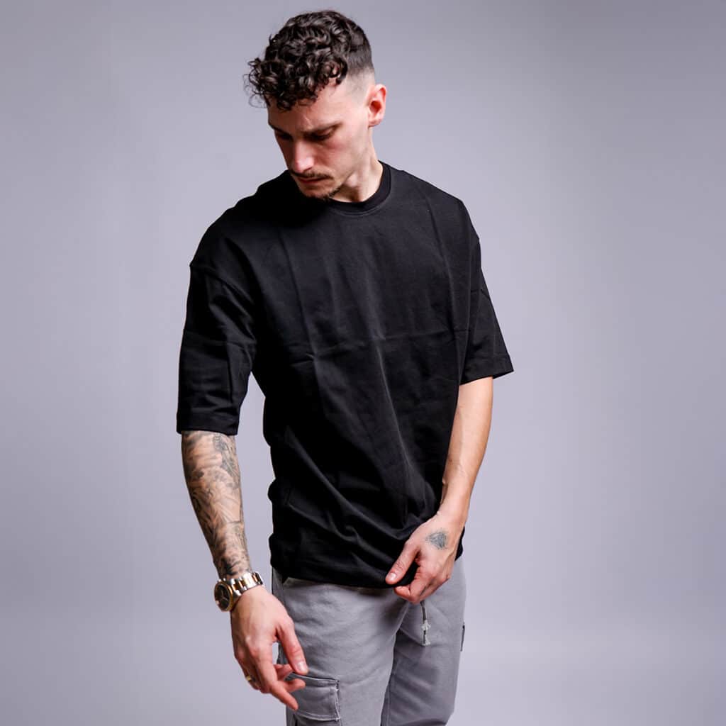 חולצה לגבר חצי גולף אוברסייז שחורה